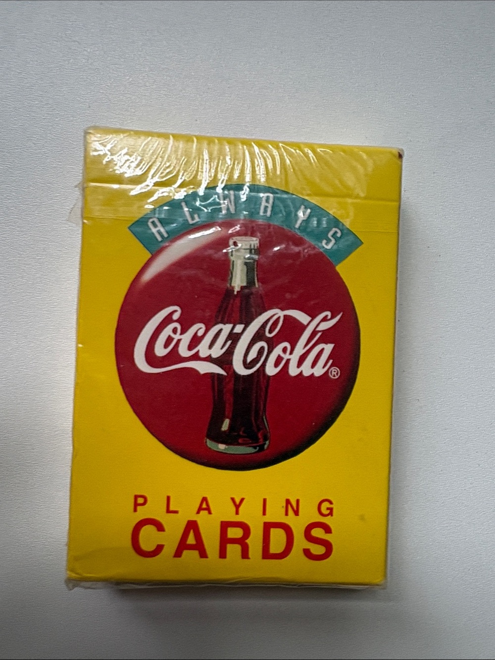 New sealed collectible Coca-Cola Yellow Deck with “Always”Red Logo and Bottle‎